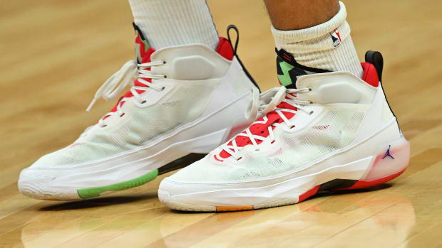 View of white and red Jordan shoes.